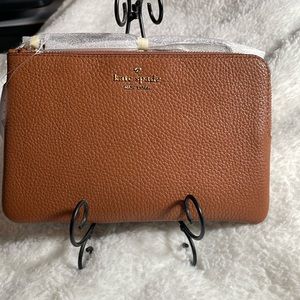 Brand new tan Kate Spade wristlet.